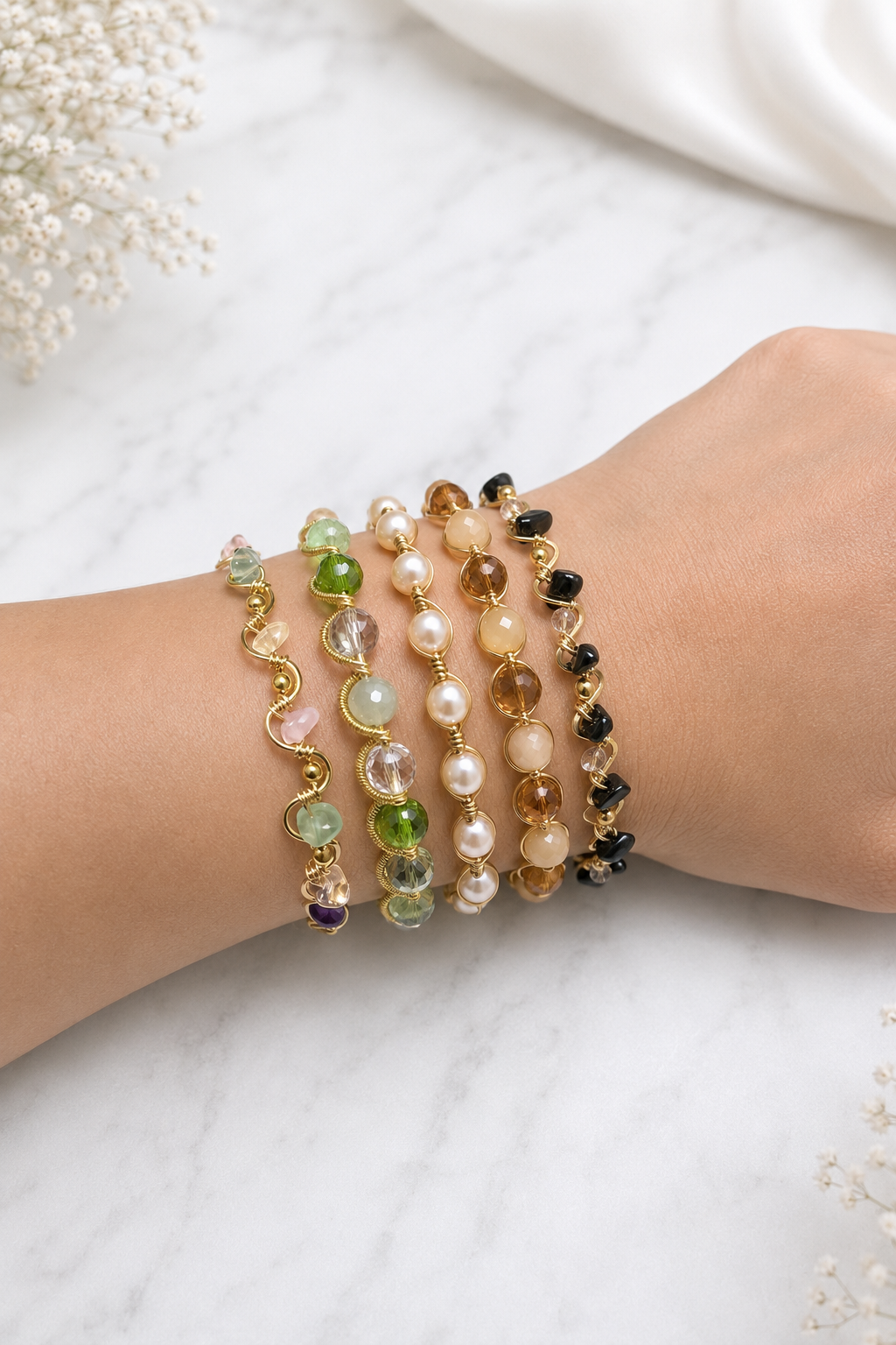 Five Bydionnise handmade bracelets worn together